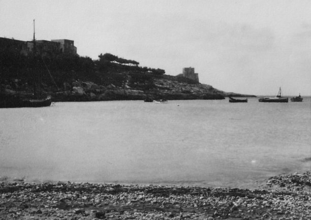 Xlendi bay and coastal watchtower