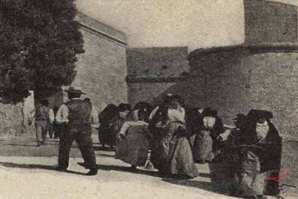 Men and women in local costumes