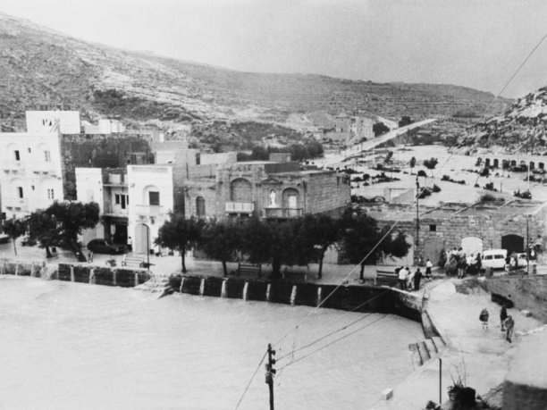 Xlendi floods and promenade scene