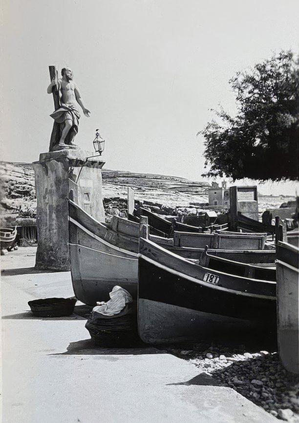 Statue of Saint Andrew and fishing boats in Xlendi