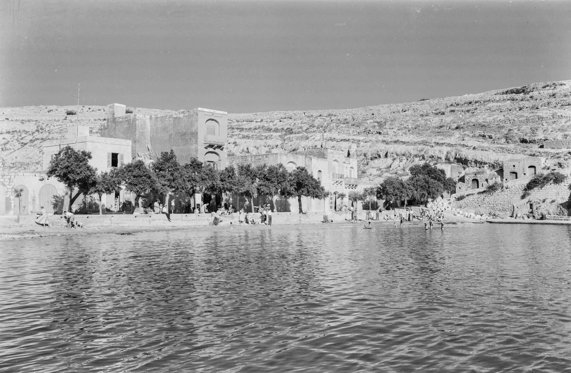 People swimming at Xlendi bay