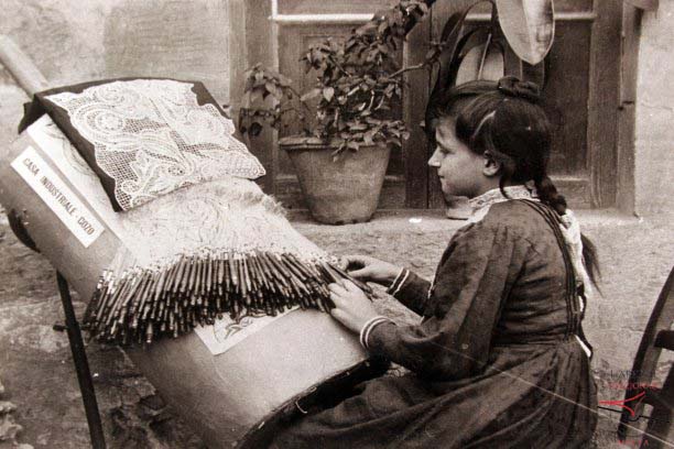 Woman crafting lace patterns