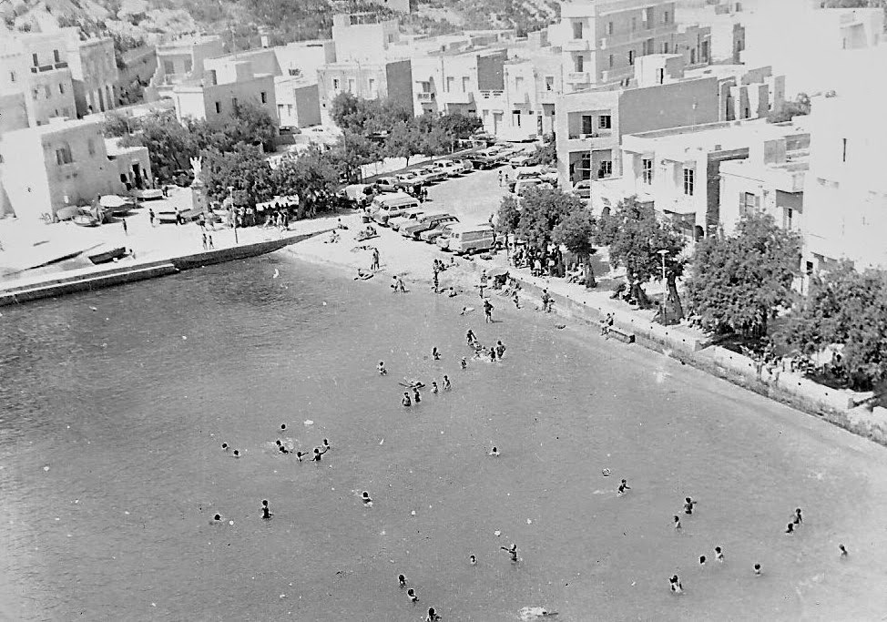 Xlendi bay swimmers and promenade