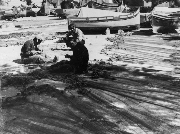 Fishermen mending their nets