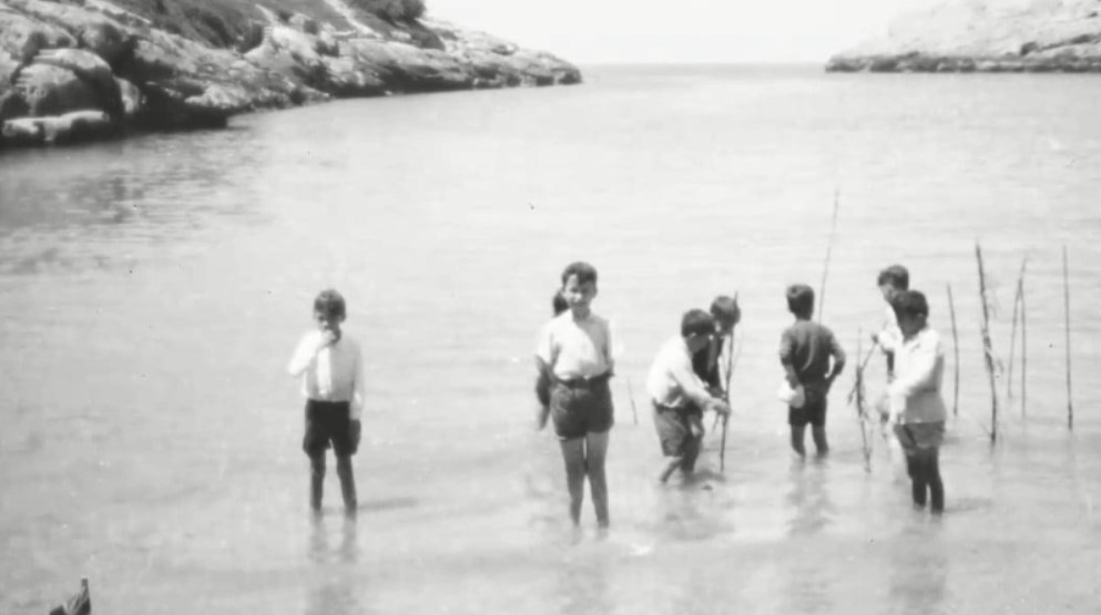 Children playing in Xlendi bay