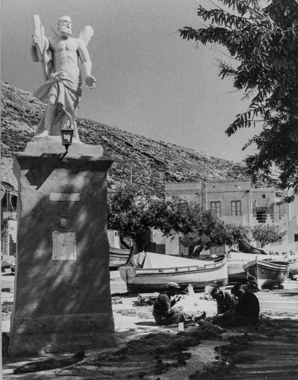 Fishermen mending nets near St Andrew's statue
