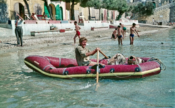 Men rowing an inflatable boat