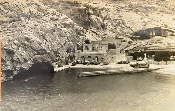 Xlendi Bay with boathouses
