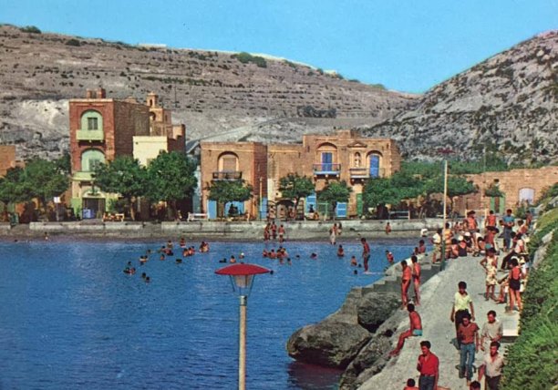 Busy summer day at Xlendi bay