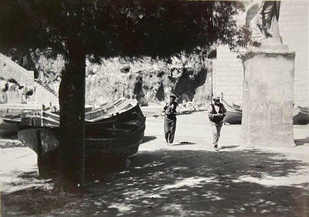 Fishermen and boats near Saint Andrew's statue, Xlendi