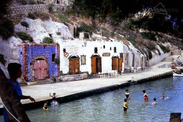 Colourful boat houses and restaurants in Xlendi bay