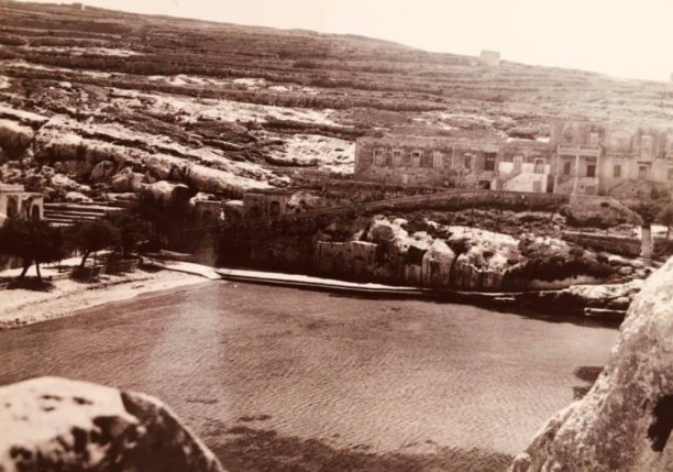Xlendi bay's quiet shores