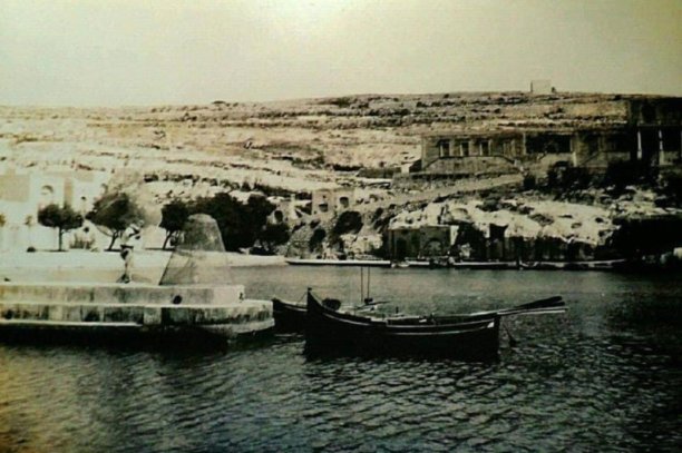 Xlendi bay with traditional boat