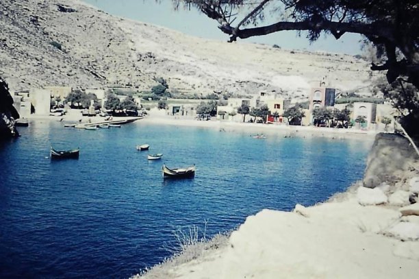 Boats floating in Xlendi bay