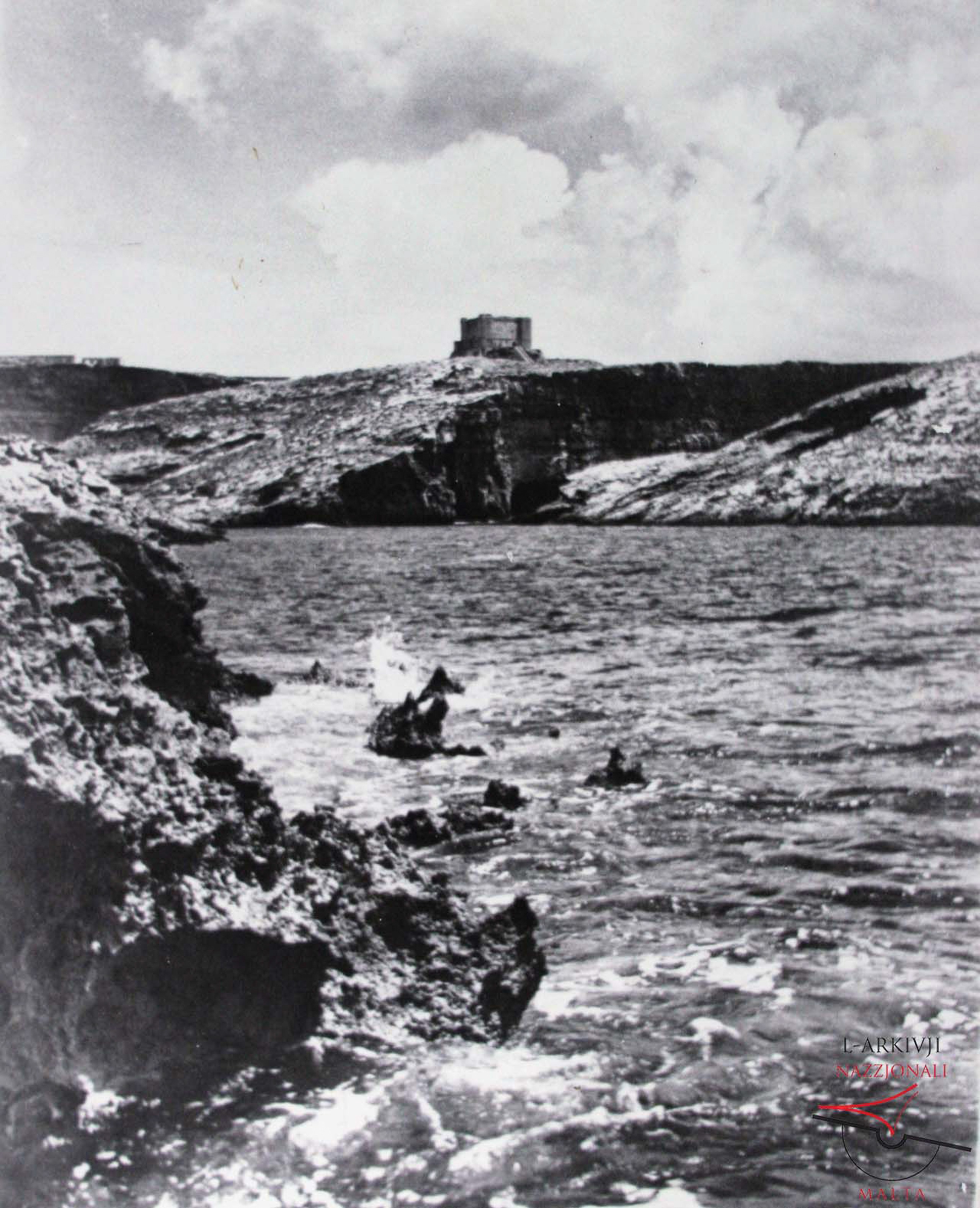Comino Tower from between the Chimneys