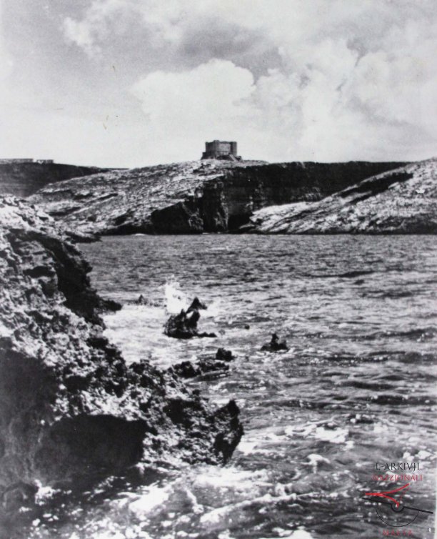 Comino Tower from between the Chimneys