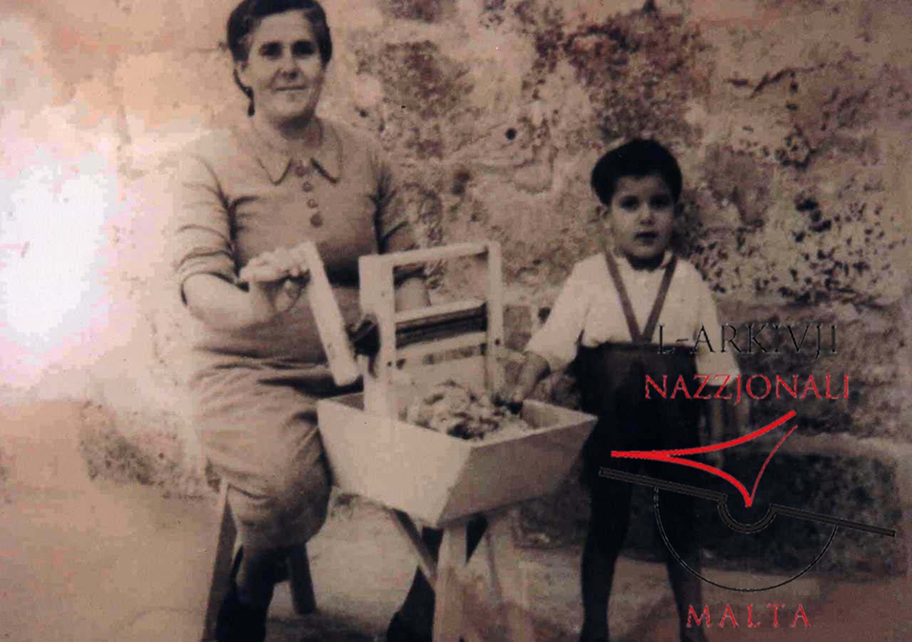 Woman separating cotton from its seed