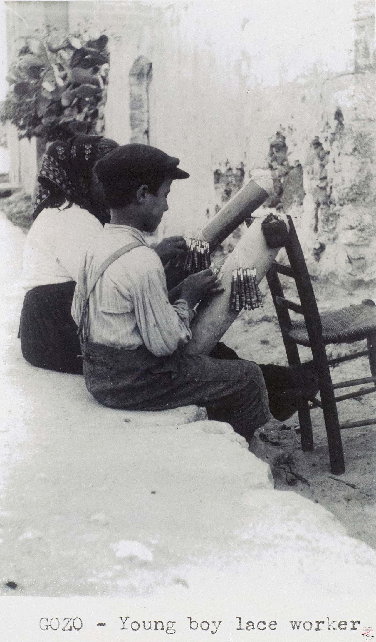 A young lace-worker boy