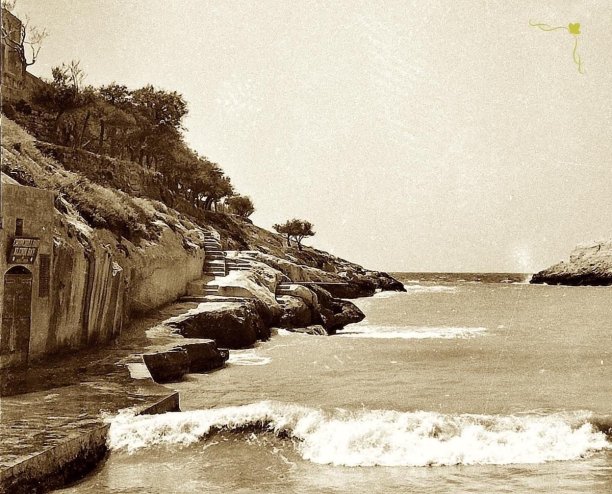 Rocky shoreline and stairway at Xlendi